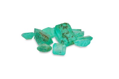 Lot 310 - TWELVE LOOSE CUT EMERALDS, of various sizes...