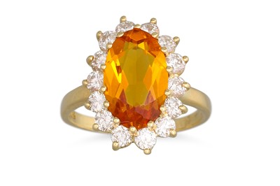 Lot 330 - A TOPAZ AND DIAMOND RING, the oval topaz to a...