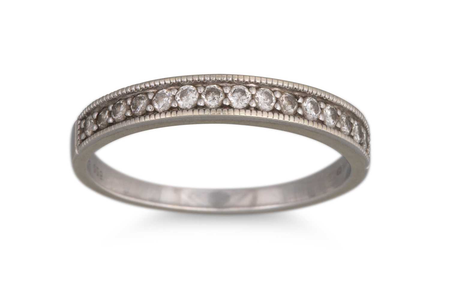 Lot 47 - A DIAMOND SET HALF ETERNITY RING, the round...