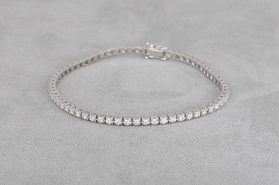 A DIAMOND LINE BRACELET, mounted in 18ct white...