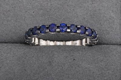 A SAPPHIRE FULL ETERNITY RING, mounted in 18ct...