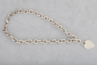Lot 164 - A TIFFANY & CO CURB LINK NECKLACE, suspending...