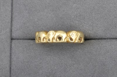 Lot 30 - AN 18CT GOLD BAND RING, with elephant motifs,...