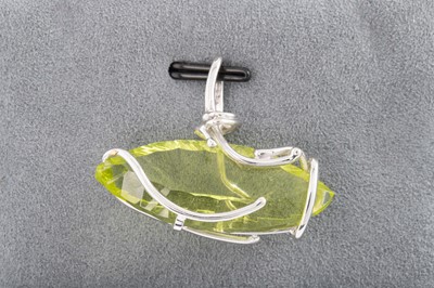 Lot 146 - A SYNTHETIC QUARTZ PENDANT, mounted in 9ct...