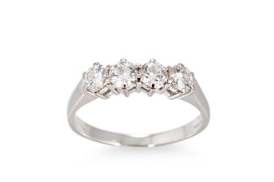 Lot 317 - A FOUR STONE DIAMOND RING, the brilliant cut...