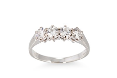 Lot 255 - A FOUR STONE DIAMOND RING, the brilliant cut...