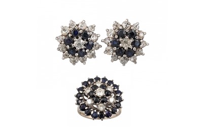 Lot 338 - A SAPPHIRE AND DIAMOND CLUSTER DRESS RING, set...