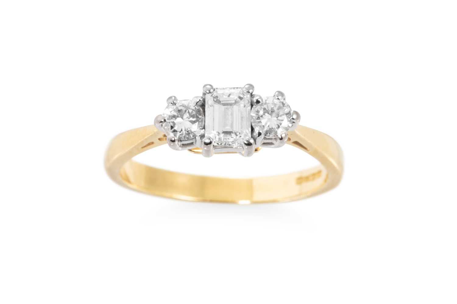 Lot 2 - A THREE STONE DIAMOND RING, set with an...