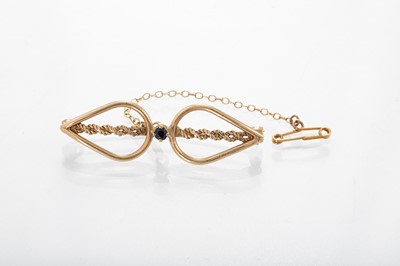Lot 96 - A SAPPHIRE OPEN BOW BROOCH, mounted in gold,...