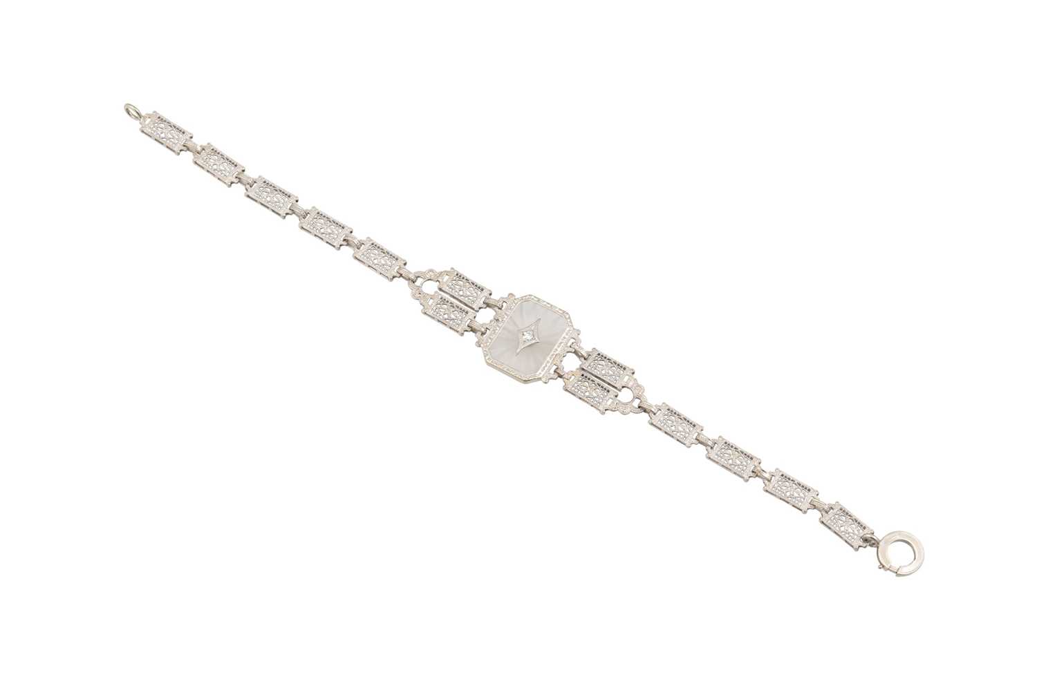 Lot 38 - A DIAMOND AND ROCK CRYSTAL SET BRACELET,...