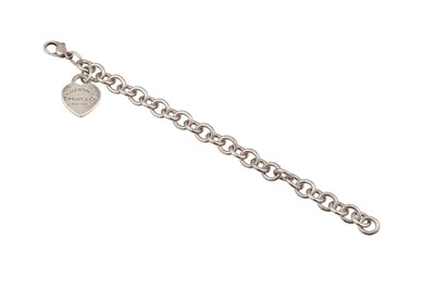 Lot 46 - A SILVER TIFFANY BRACELET, suspending a love...