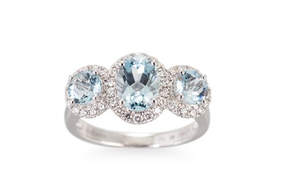 Lot 199 - AN AQUAMARINE AND DIAMOND THREE STONE CLUSTER...
