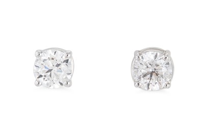 Lot 236 - A PAIR OF DIAMOND STUD EARRINGS, both with GIA...