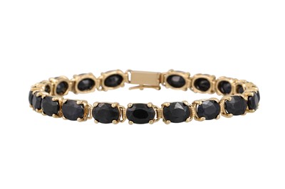 Lot 123 - A SAPPHIRE SET BRACELET, the oval sapphires...
