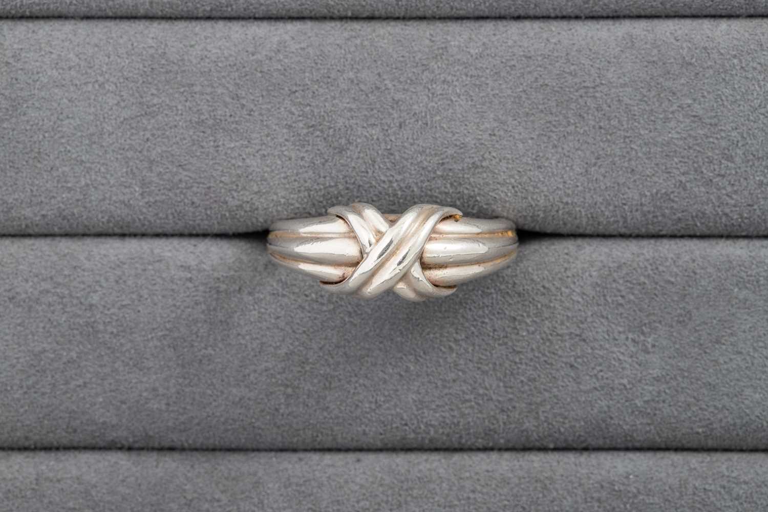 Lot 30 - A SILVER TIFFANY RING, x-shaped design, signed,...