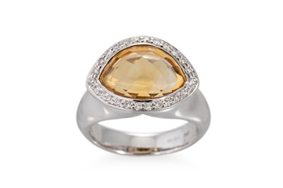 Lot 261 - A CITRINE AND DIAMOND CLUSTER DRESS RING, the...