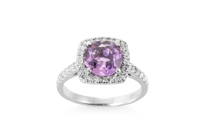 Lot 296 - AN AMETHYST AND DIAMOND CLUSTER RING, the...