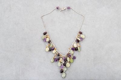 Lot 36 - A MULTI STONE SET NECKLACE, mounted in silver