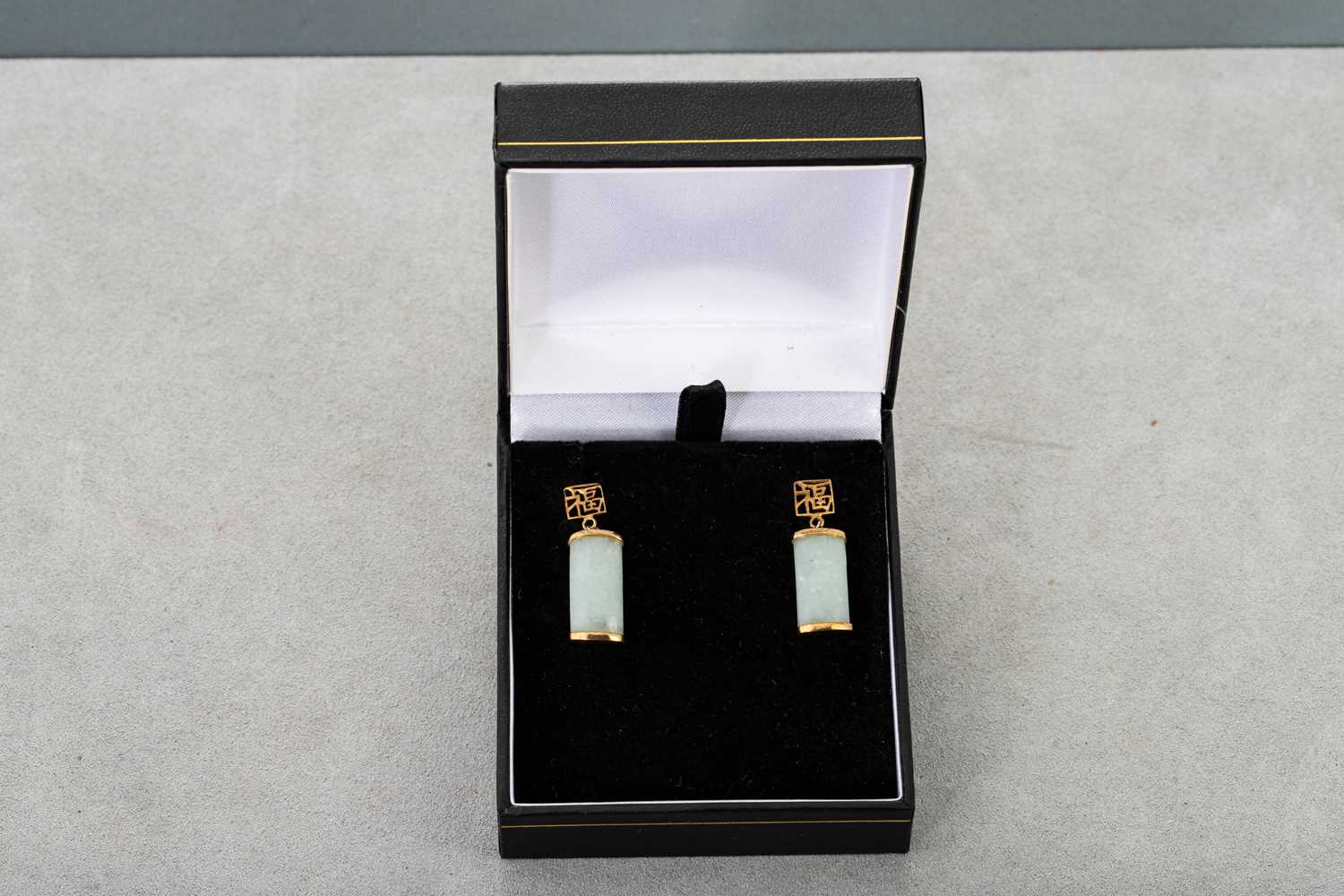 Lot 65 - A PAIR OF JADE EARRINGS, mounted in 14ct gold