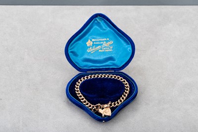 Lot 77 - A 9CT GOLD CURB LINK BRACELET, engraved...