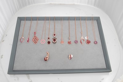 Lot 176 - A COLLECTION OF RED/PINK STONE SET PENDANTS,...