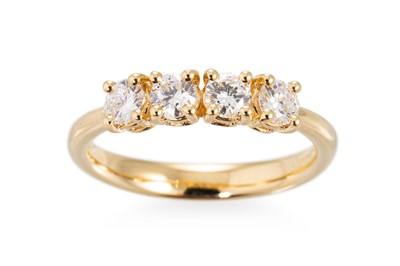 Lot 302 - A FOUR STONE DIAMOND RING, the brilliant cut...