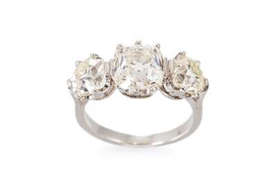 Lot 229 - AN OLD CUT DIAMOND THREE STONE RING, the...