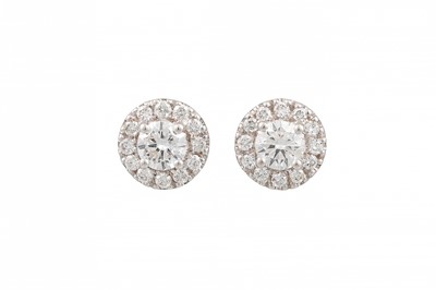 Lot 65 - A PAIR OF DIAMOND CLUSTER EARRINGS, set with...