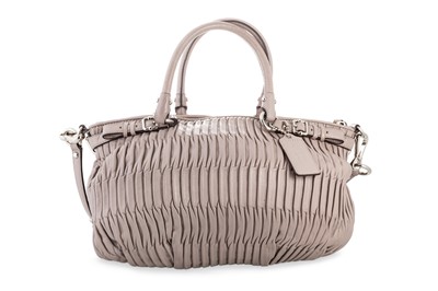 Lot 246 - A LADY'S COACH HANDBAG, mauve coloured leather,...