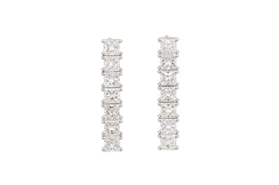 Lot 73 - A PAIR OF DIAMOND DROP EARRINGS, the princess...