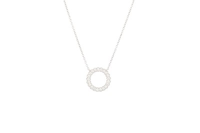 Lot 77 - A DIAMOND PENDANT, of circular form set with...