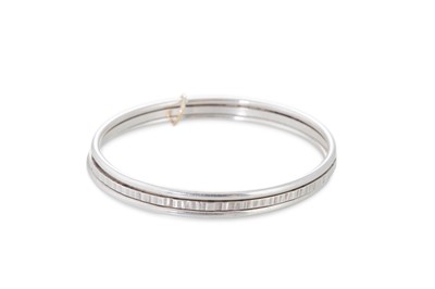 Lot 90 - A STERLING SILVER BANGLE, with maker's mark,...