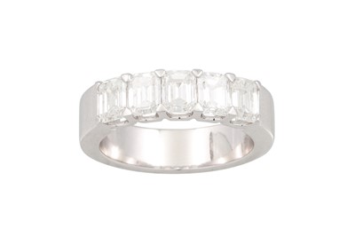 Lot 83 - A DIAMOND FIVE STONE RING, the emerald cut...