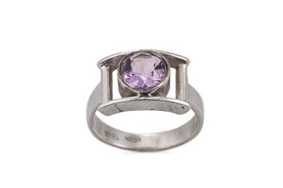 Lot 376 - A NIAMH UTSCH AMETHYST RING, the round cut...