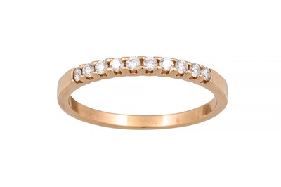Lot 165 - A DIAMOND HALF ETERNITY RING, the brilliant...