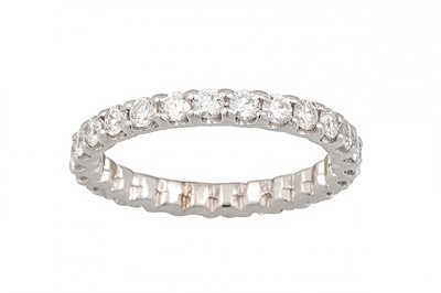 Lot 166 - A DIAMOND ETERNITY RING, the brilliant cut...
