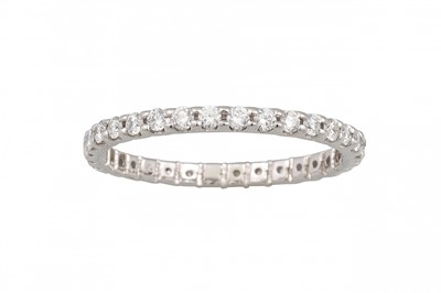 Lot 174 - A DIAMOND ETERNITY RING, the brilliant cut...