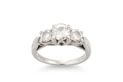 Lot 355 - A DIAMOND THREE STONE RING, mounted in...