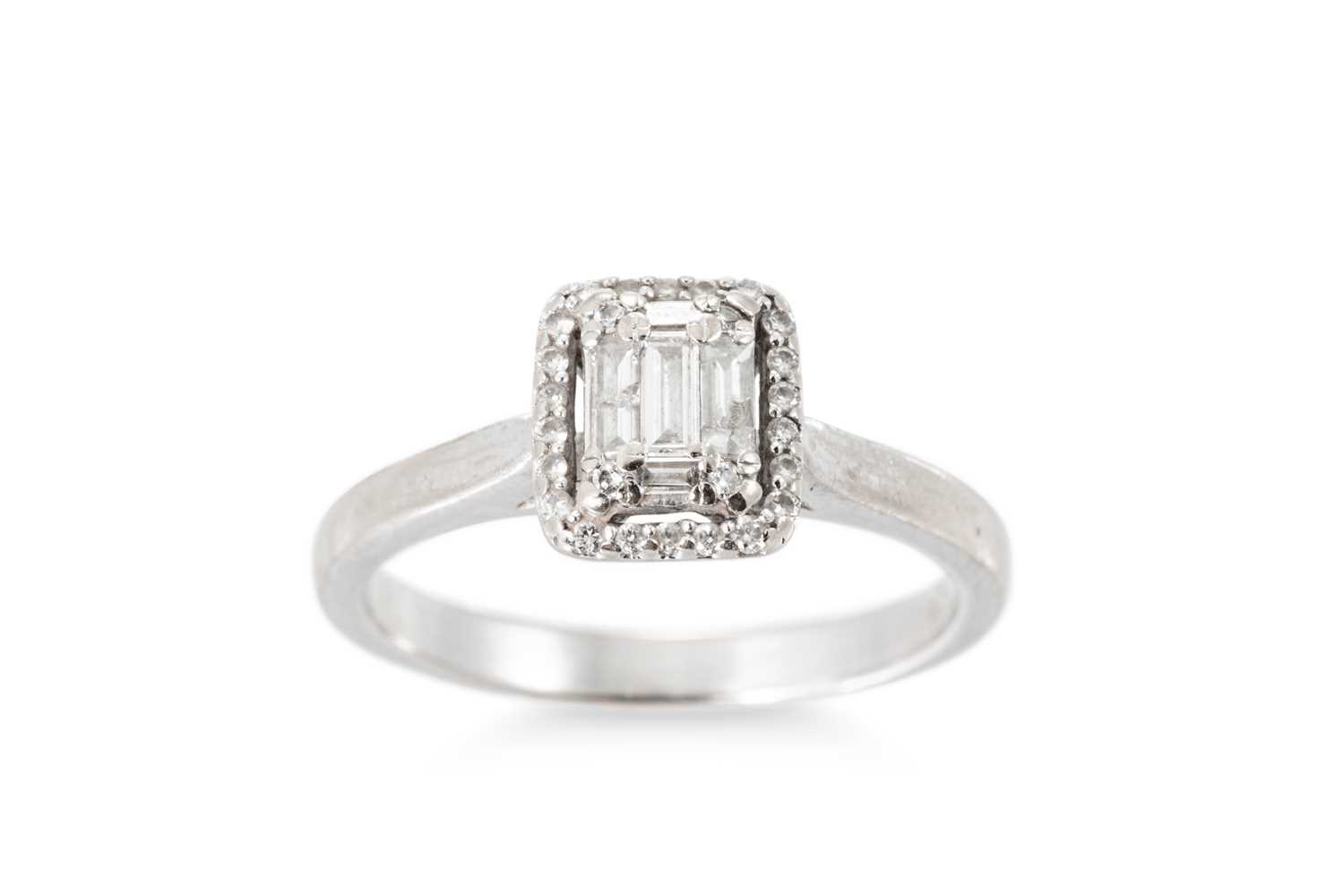 Lot 114 - A DIAMOND CLUSTER RING, the baguette and round...