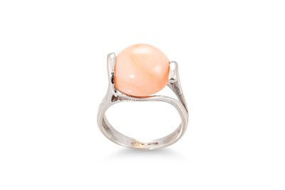 Lot 220 - A CORAL SET RING, the angel skin coral mounted...