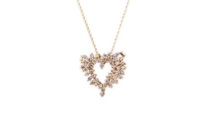 Lot 344 - A DIAMOND SET HEART SHAPED PENDANT, mounted in...