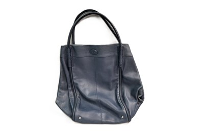 Lot 523 - A TOD'S HOBO STYLE HANDBAG, navy leather with...