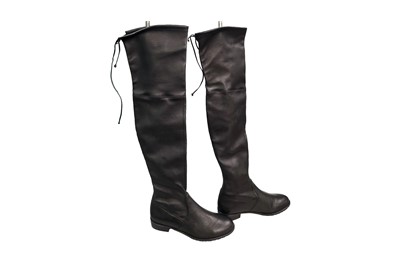 Lot 524 - A PAIR OF STUART WEITZMEN LEATHER BOOTS, with...