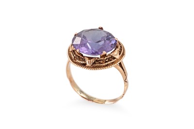 Lot 2 - A DIAMOND AND GEM SET RING, of abstract form...