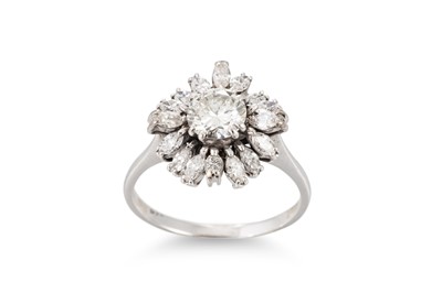Lot 264 - A DIAMOND CLUSTER RING, the central brilliant...