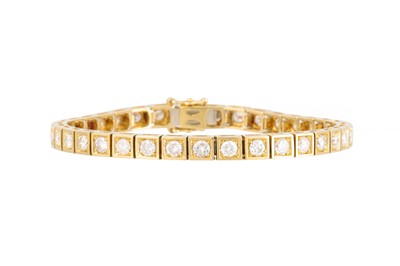 Lot 351 - A DIAMOND LINE BRACELET, the brilliant cut...