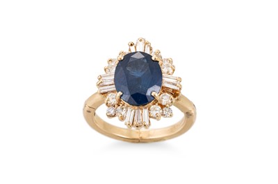 Lot 257 - A SAPPHIRE AND DIAMOND CLUSTER RING, the oval...