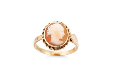 Lot 259 - A 9CT YELLOW GOLD RING, set with a carved...