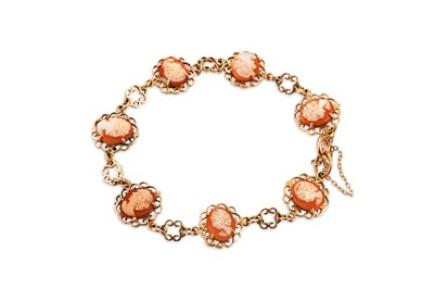 Lot 260 - A 9CT YELLOW GOLD BRACELET, set with seven...