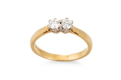 Lot 395 - A TWO STONE DIAMOND RING, mounted in 18ct gold....